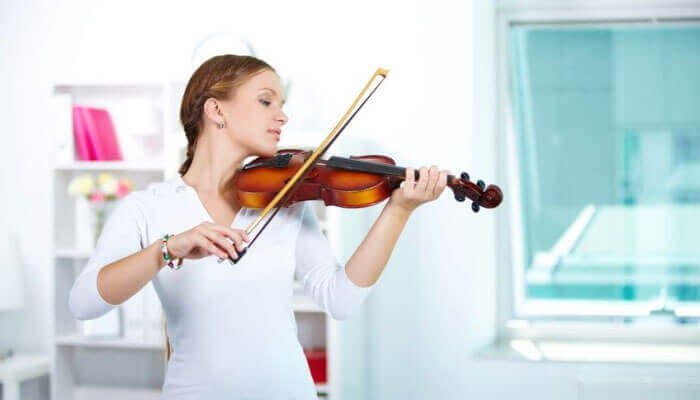 young female playing the violin