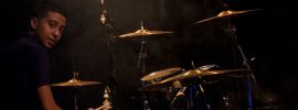 boy playing drum songs