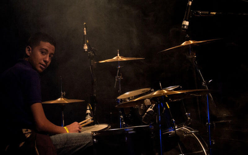 boy playing drum songs